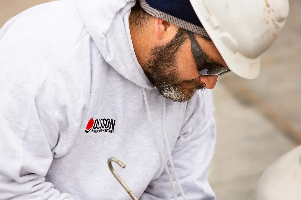 Slide of Olsson Roofing