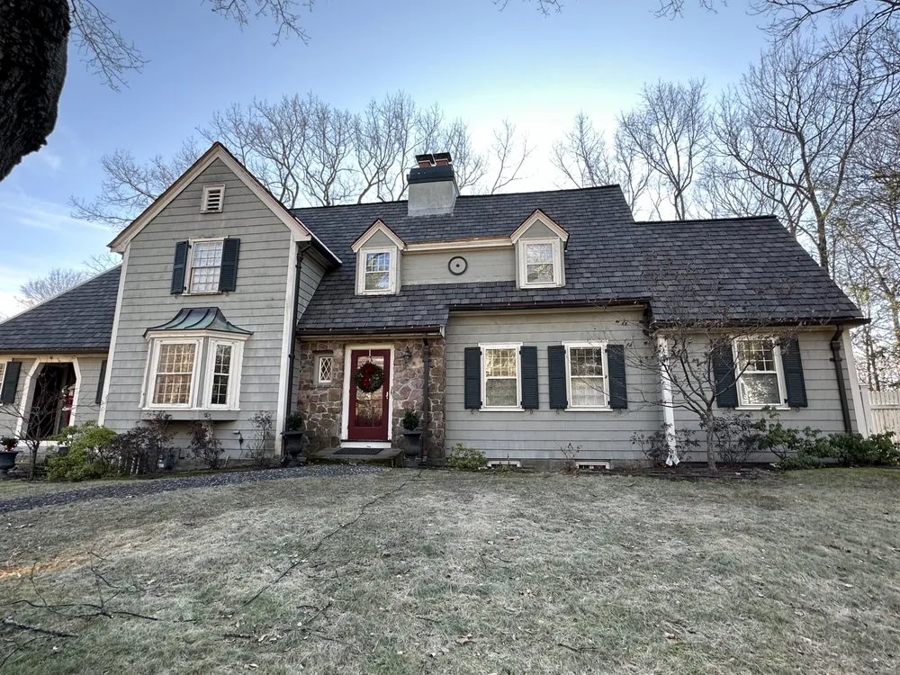 Slide of O'LYN Roofing