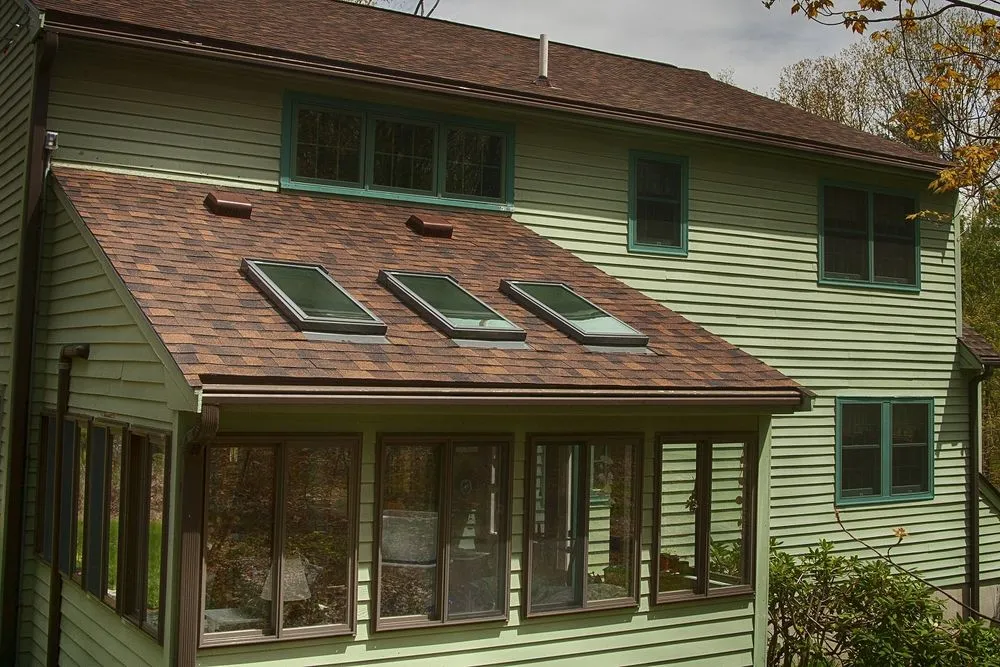 Slide of O'LYN Roofing