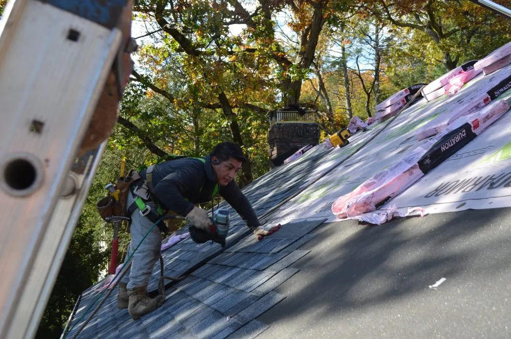 Slide of O'LYN Roofing