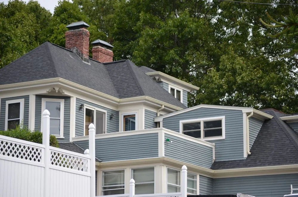 Slide of O'LYN Roofing