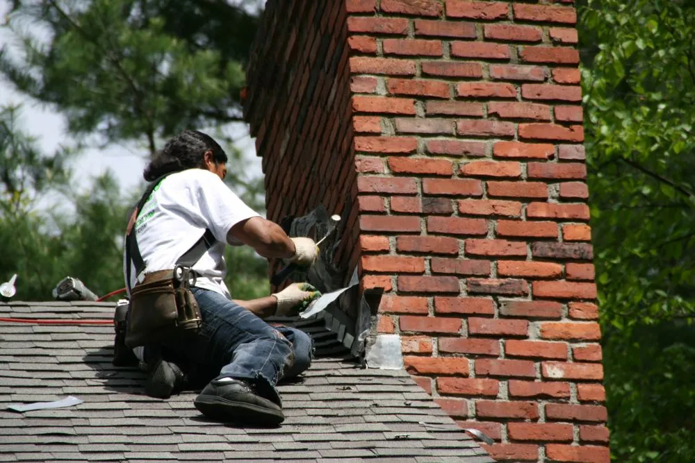 Slide of O'LYN Roofing
