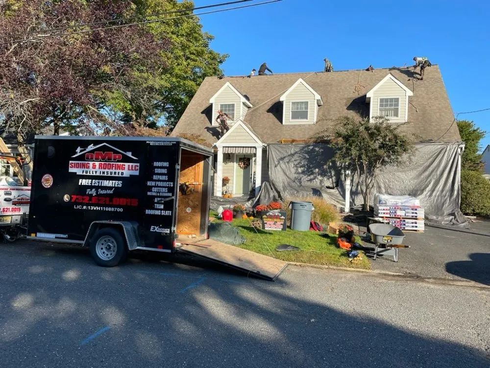 Slide of OMP Roofing and Siding