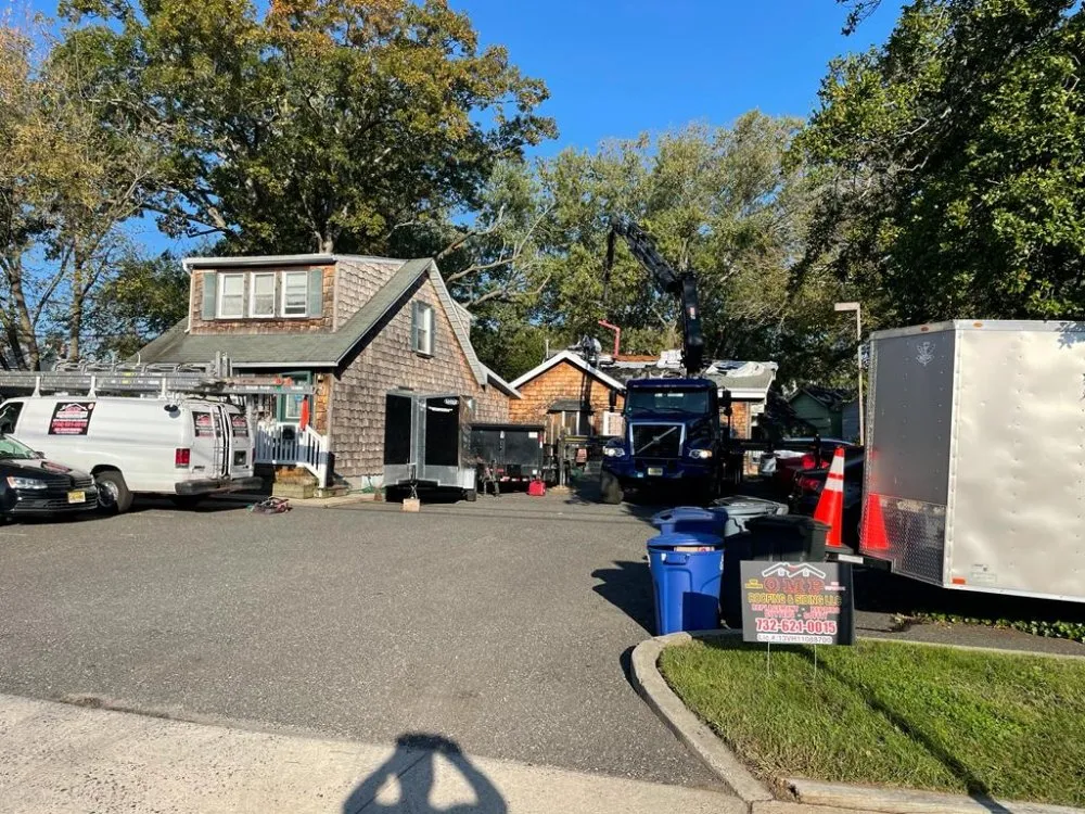 Slide of OMP Roofing and Siding