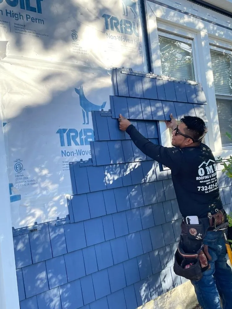 Slide of OMP Roofing and Siding