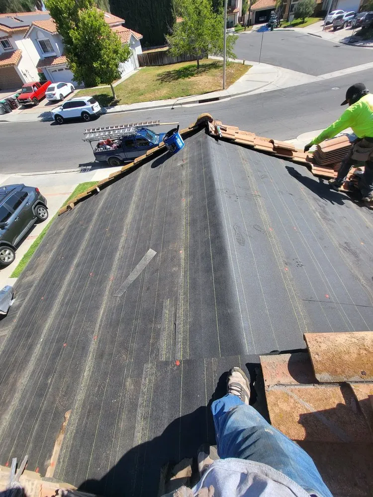 Slide of On Point Roofing Repair