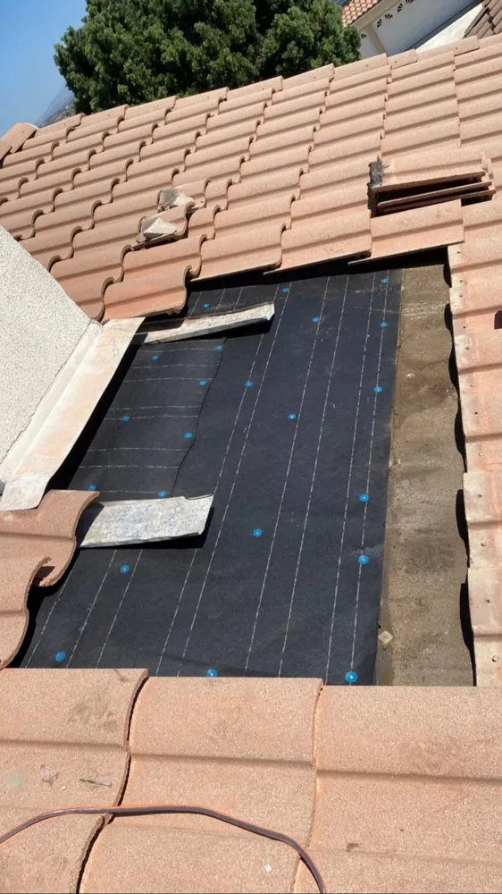 Slide of On Point Roofing Repair