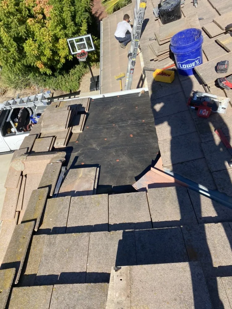 Slide of On Point Roofing Repair