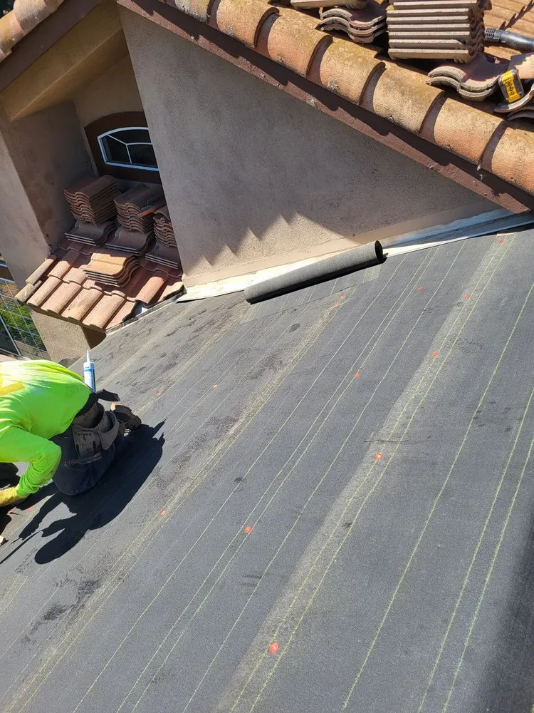 Slide of On Point Roofing Repair