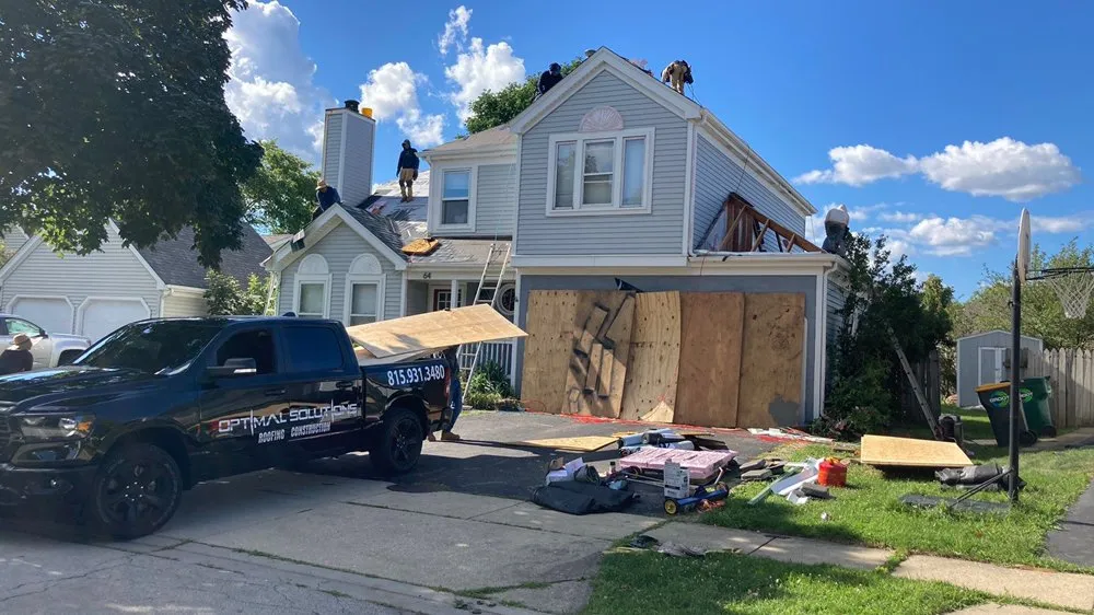 Slide of Optimal Solutions Roofing Construction