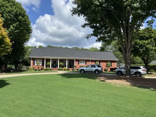 Optimum Roofing Logo