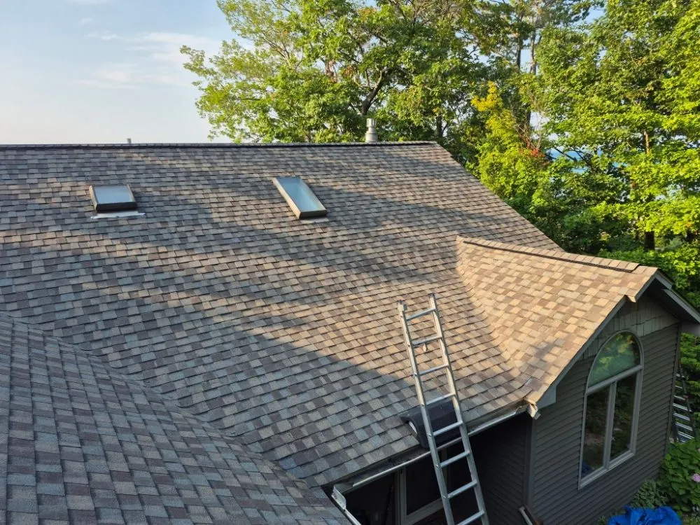 Local metal roofing installation with free inspection in Buckley, MI by Optimum Roofing Solutions