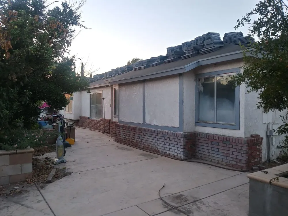 Slide of Ortiz Roofing and Construction Company