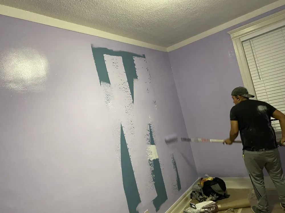 Slide of Oscars Painting Construction & Roofing