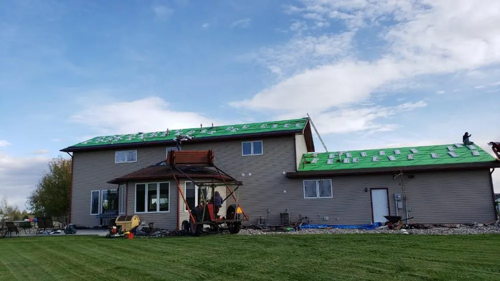 Slide of Osman Roofing Company