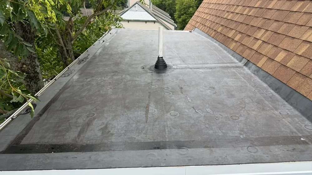 Slide of Otukan Roofing