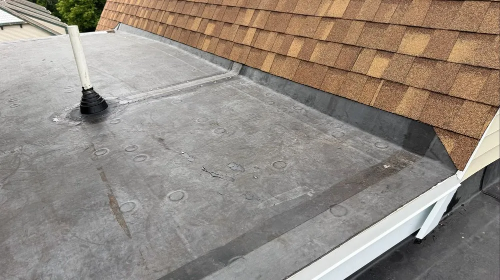 Slide of Otukan Roofing