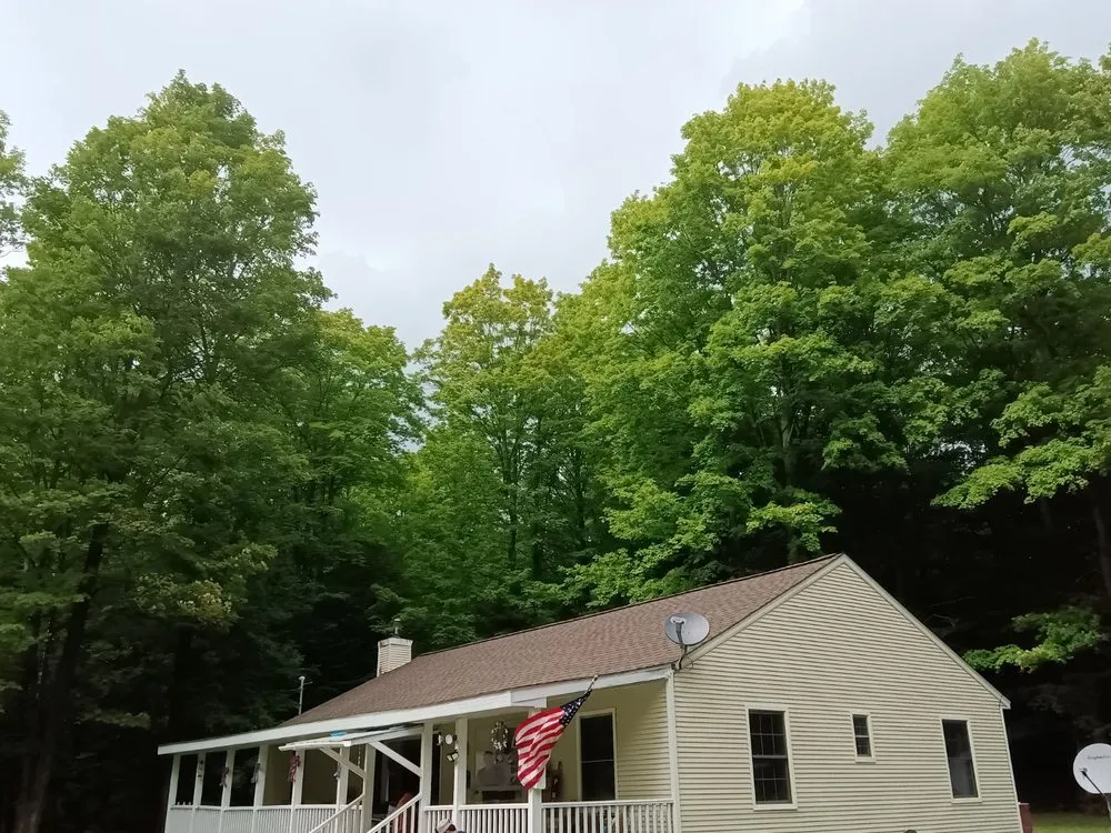 Trusted roof repair for residential properties in Williamsburg, MI by Outdoor Living & Exteriors