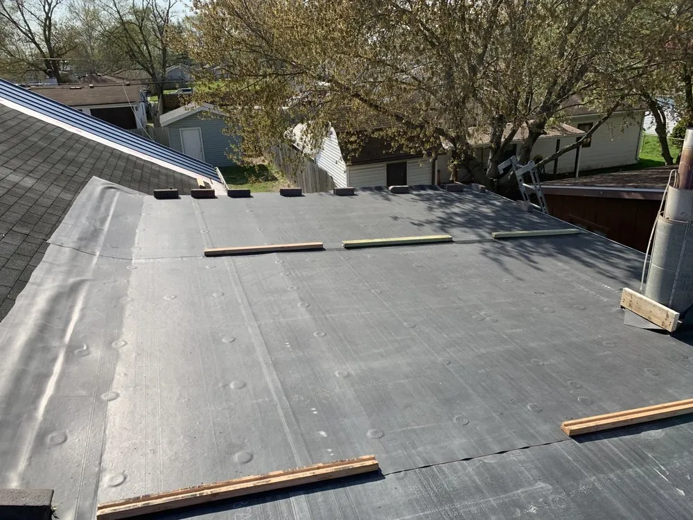 Professional storm damage roof repair same-day service in Middletown, IL by Outlaw Design