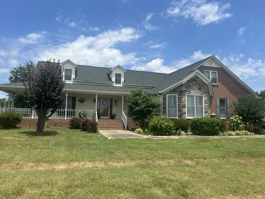 Over The Top Roofing Logo