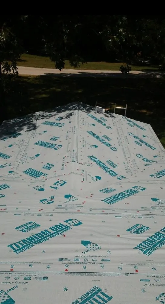 Slide of Ozark Quality Roofing