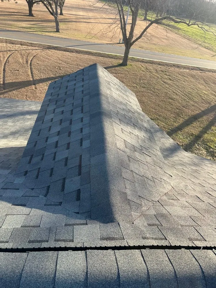 Slide of Palma's Roofing Experts