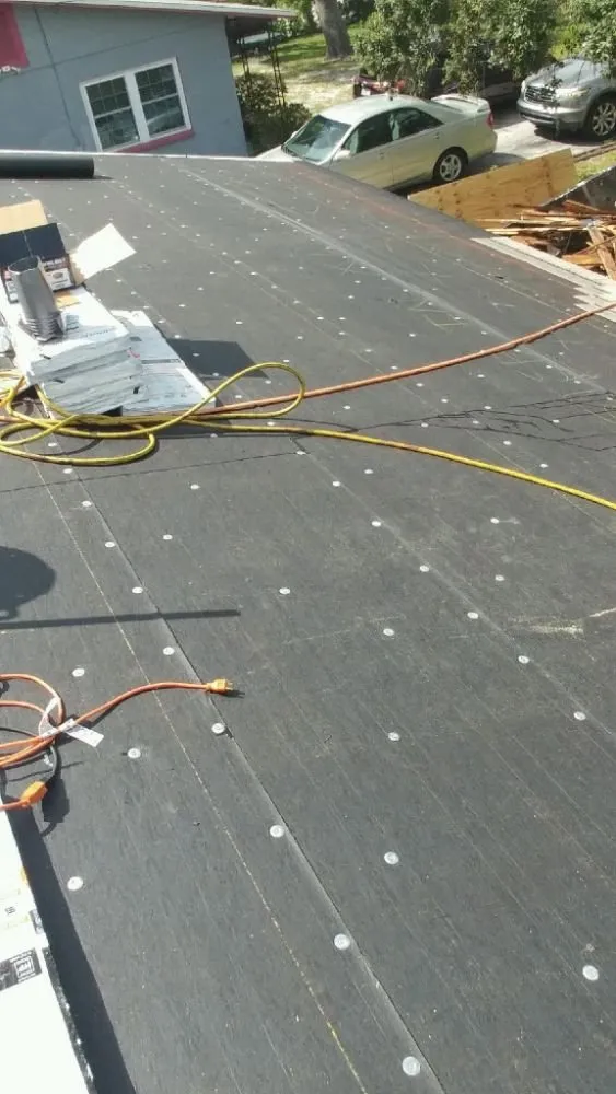 Licensed storm damage roof repair in Gulf Port, FL by Parrish and Sons Roofing