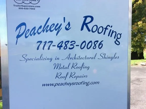 Slide of Peachey's Roofing