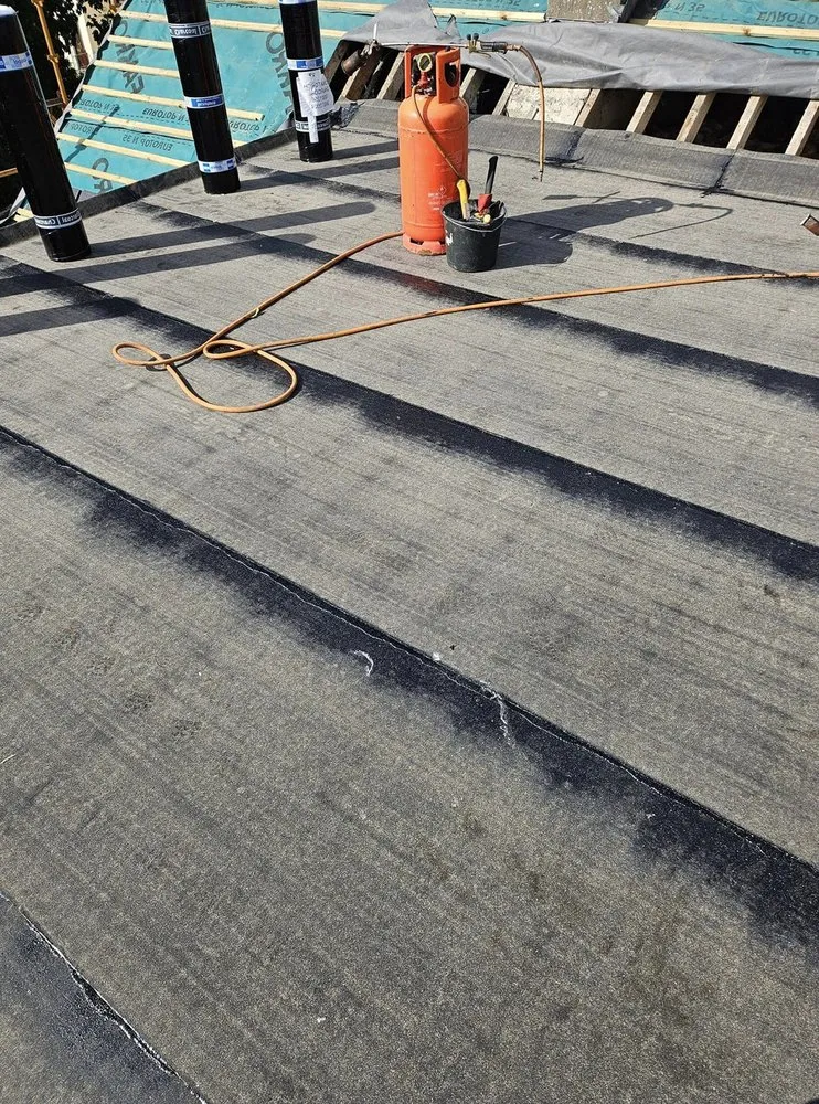 Slide of Pecan Park Roofing