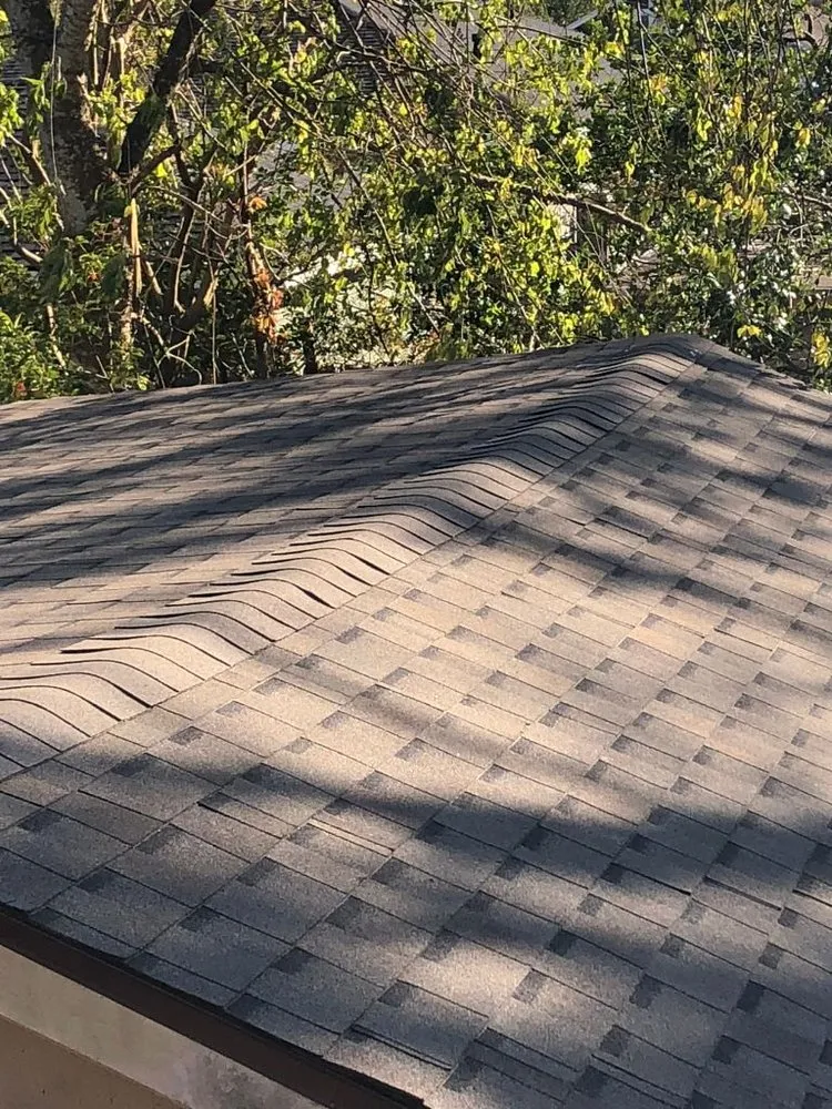 Slide of Pelican Roofing Company