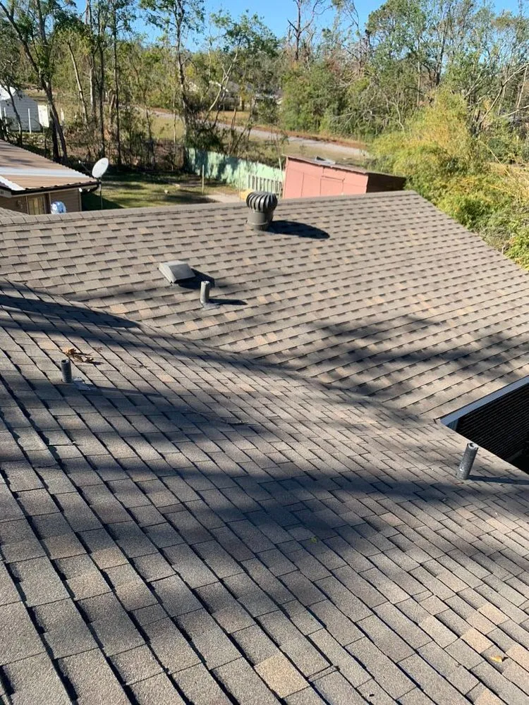 Slide of Pelican Roofing Company