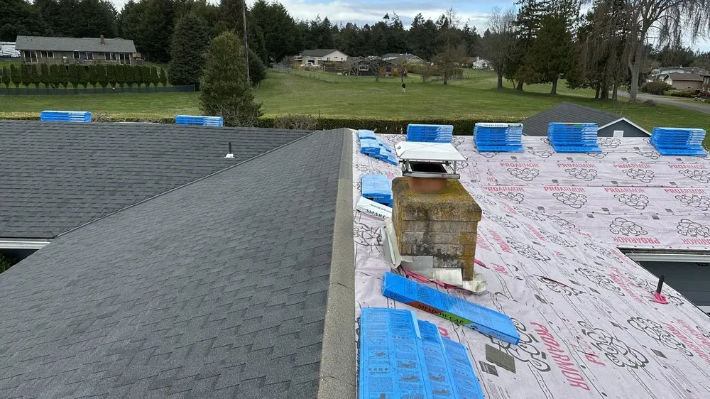 Slide of Peninsula Peaks Roofing