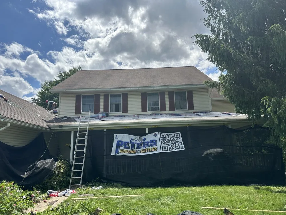 Slide of Peters Roofing and Gutters