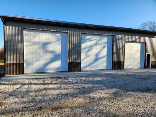 Petersheim Metal Roofing & Construction Logo
