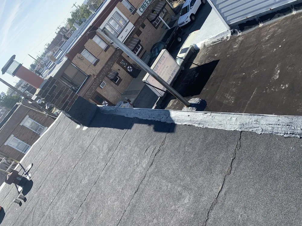 Slide of Philly's Phinest Roofing