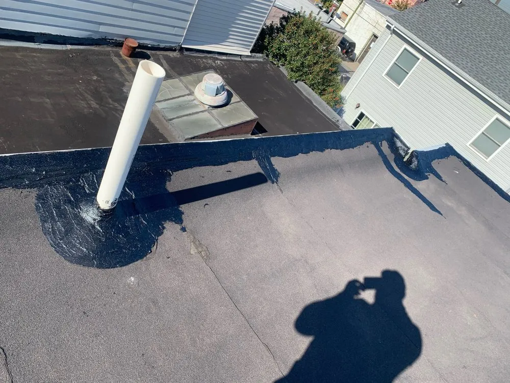 Slide of Philly's Phinest Roofing