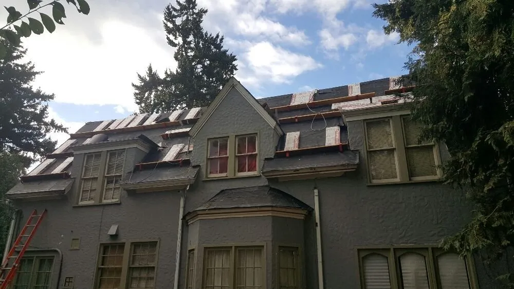 Slide of Pinnacle Roofing & Construction