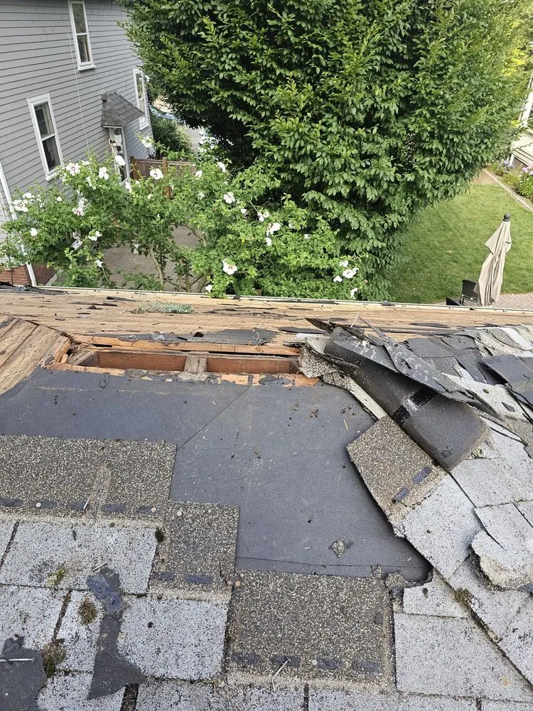 Professional storm damage roof repair after storm damage in North Attleboro, MA by Pride Exteriors