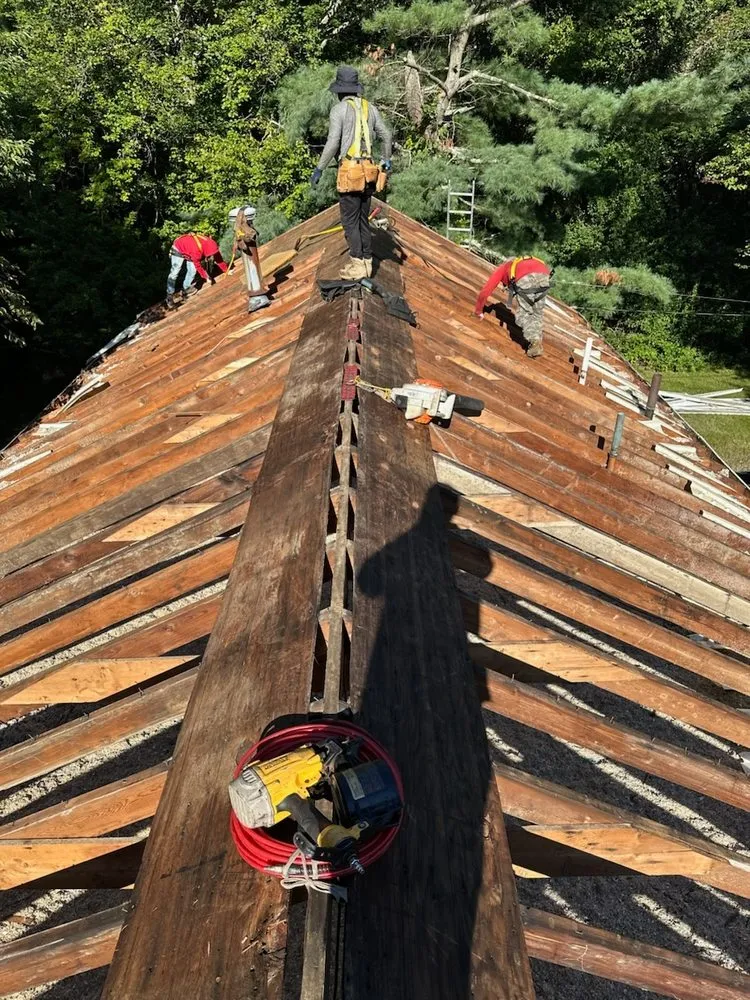Licensed storm damage roof repair with free inspection in North Attleboro, MA by Pride Exteriors