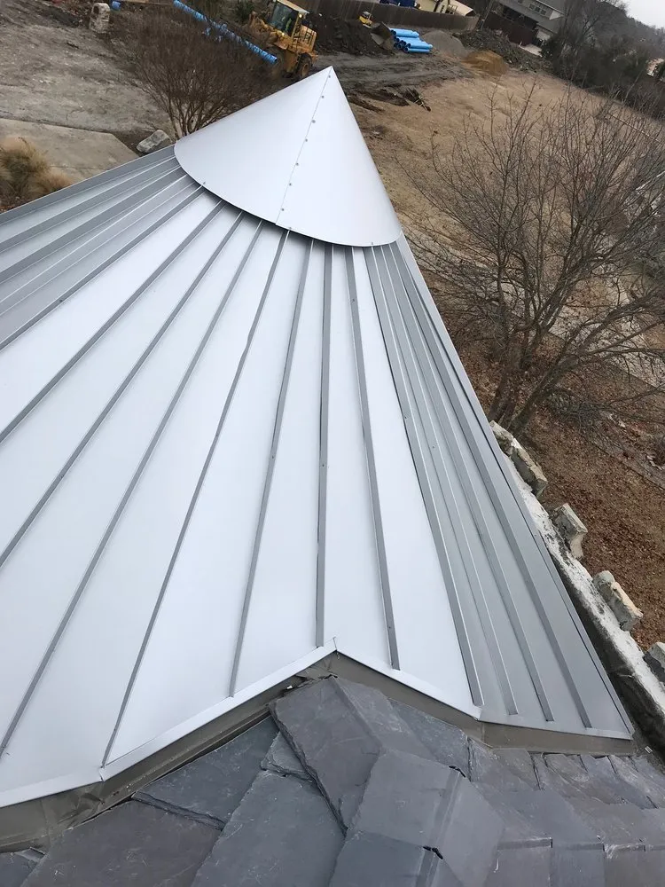 Emergency storm damage roof repair in Ofallon, MO by Pro Roofing & Restoration