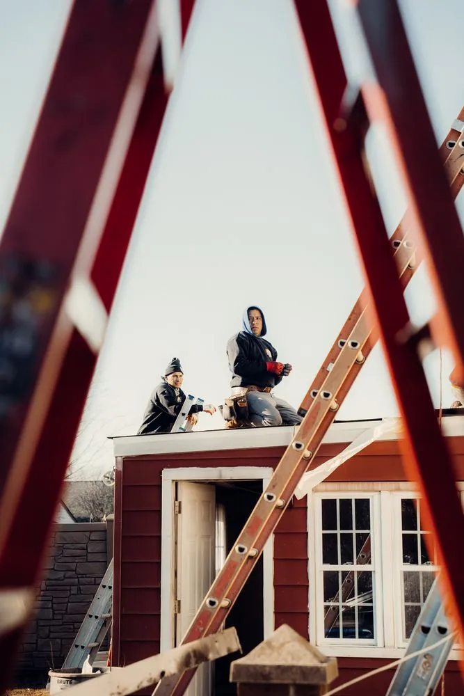 Slide of QB Roofing Solutions