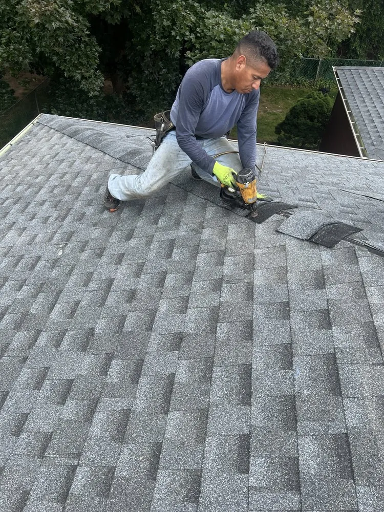 Slide of QB Roofing Solutions