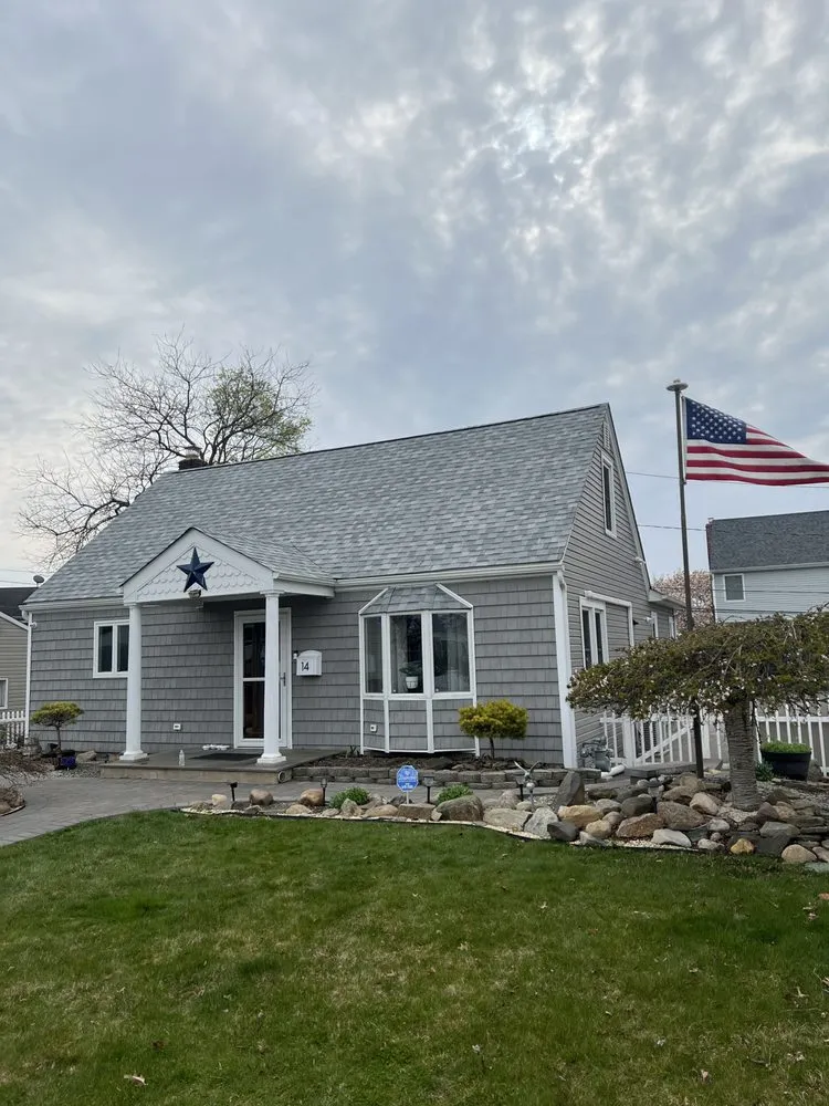 Slide of QB Roofing Solutions