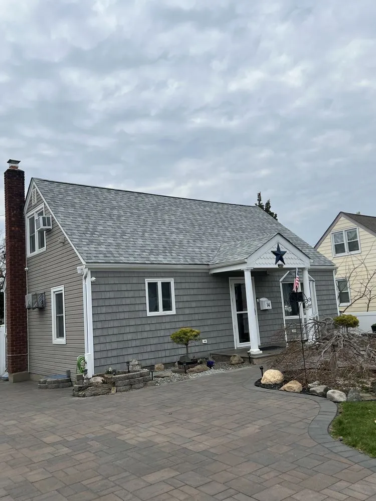 Slide of QB Roofing Solutions