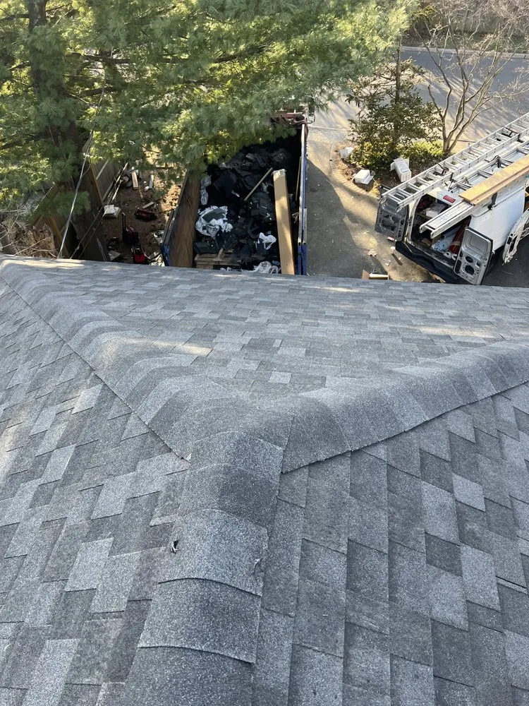 Slide of QB Roofing Solutions