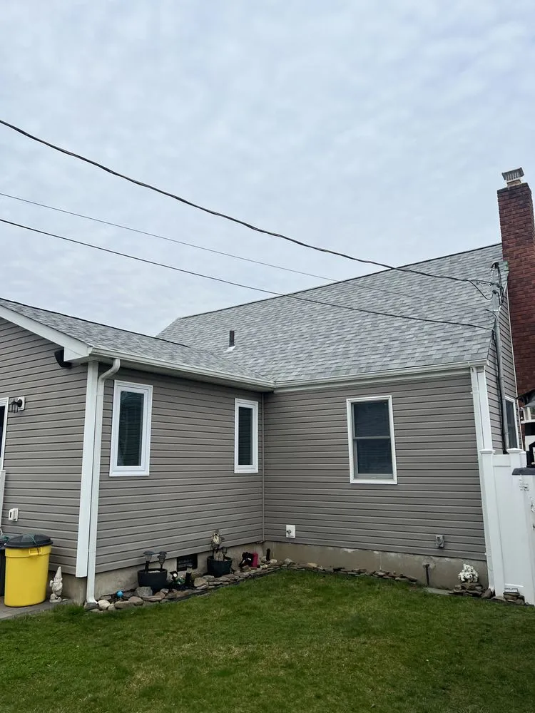 Slide of QB Roofing Solutions