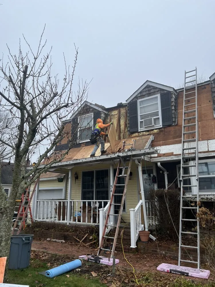 Slide of QB Roofing Solutions