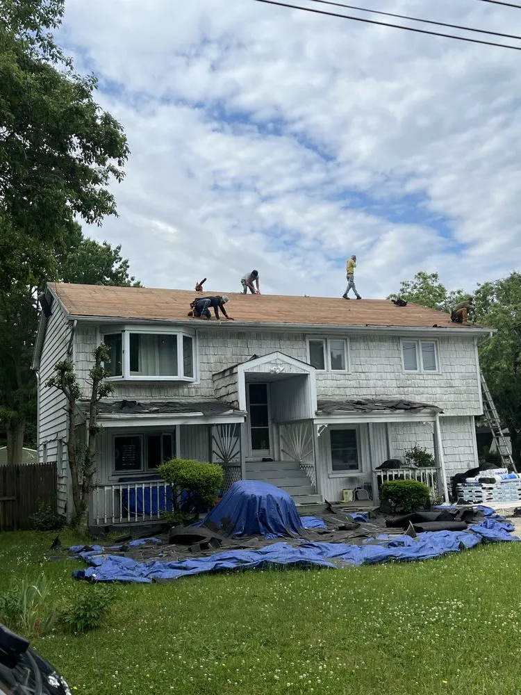 Slide of QB Roofing Solutions