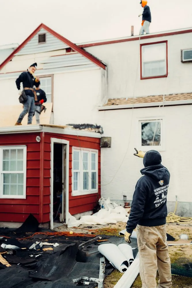 Slide of QB Roofing Solutions