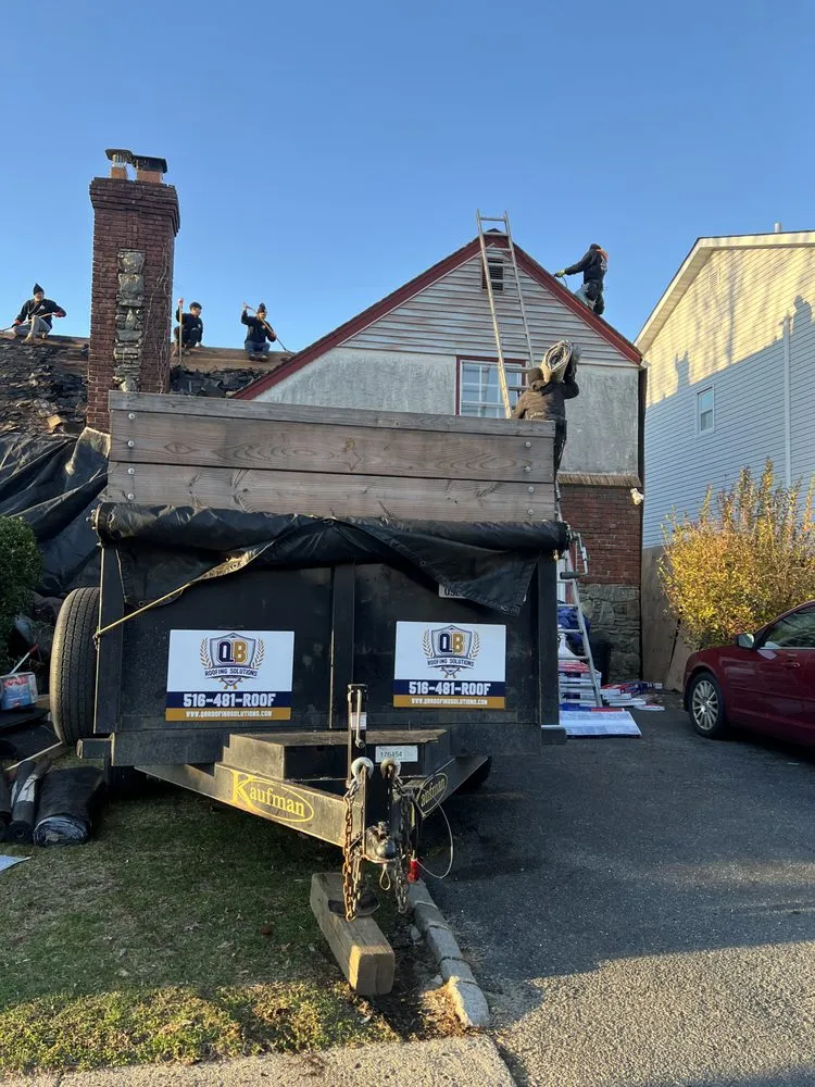 Slide of QB Roofing Solutions